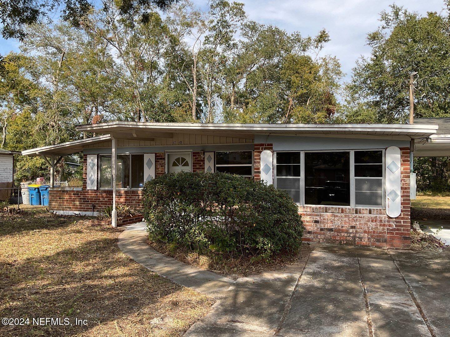 front view of a house with a garden