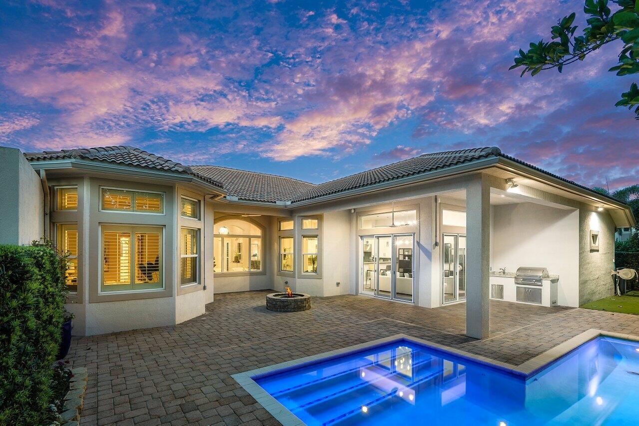 a room with pool table and windows