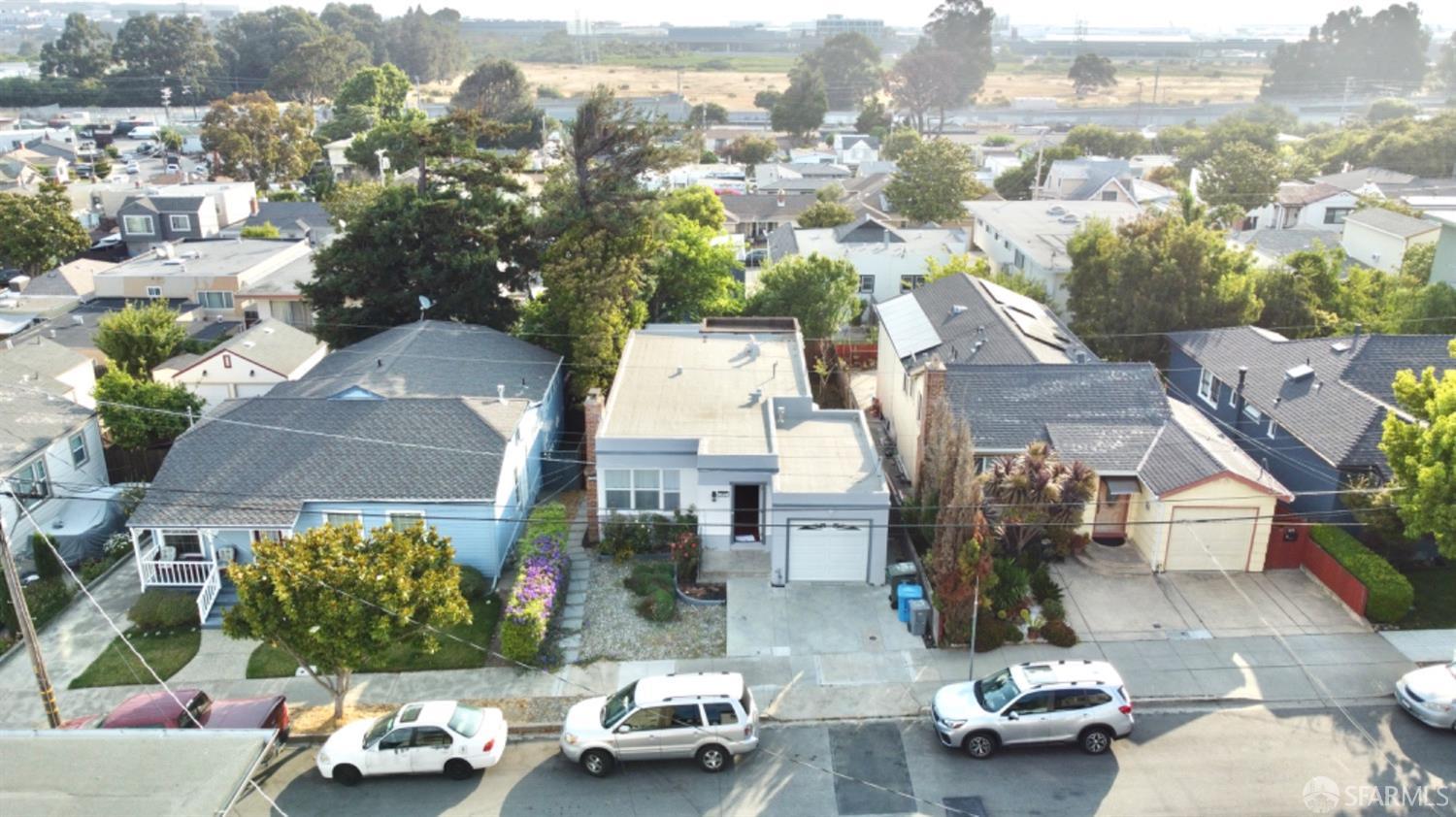 an aerial view of a houses with yard