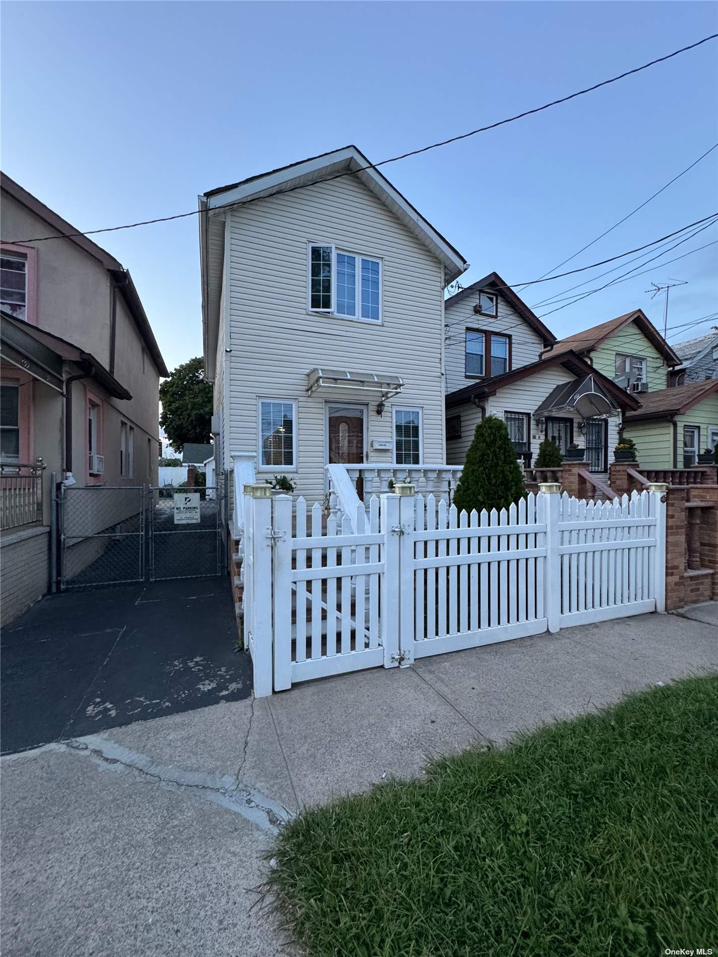 a view of a house with wooden fence