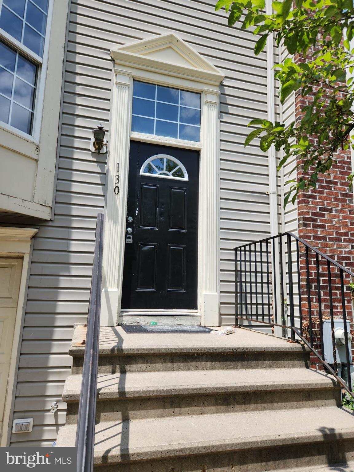 a view of a house with a door and a window