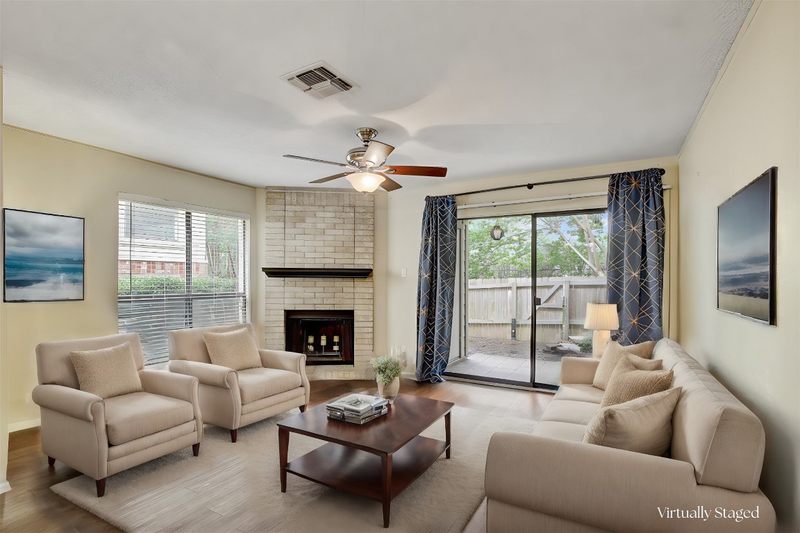 a living room with furniture and a fireplace