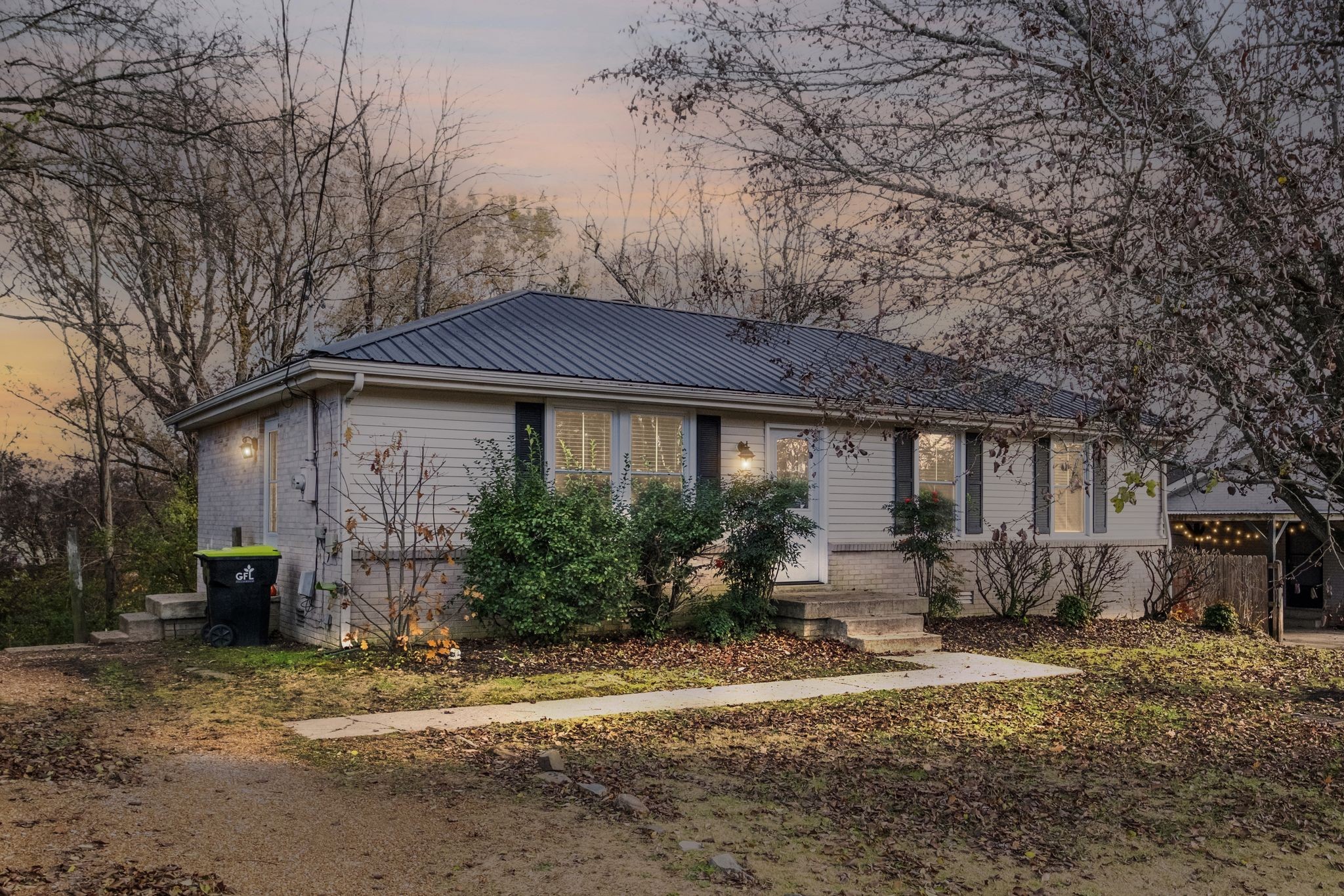 a front view of a house with garden