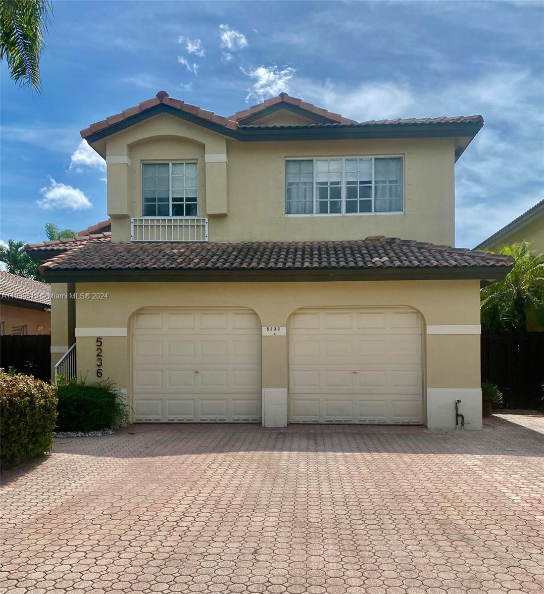 a front view of a house with a garage