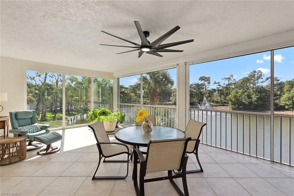 a dining room with furniture window and outside view