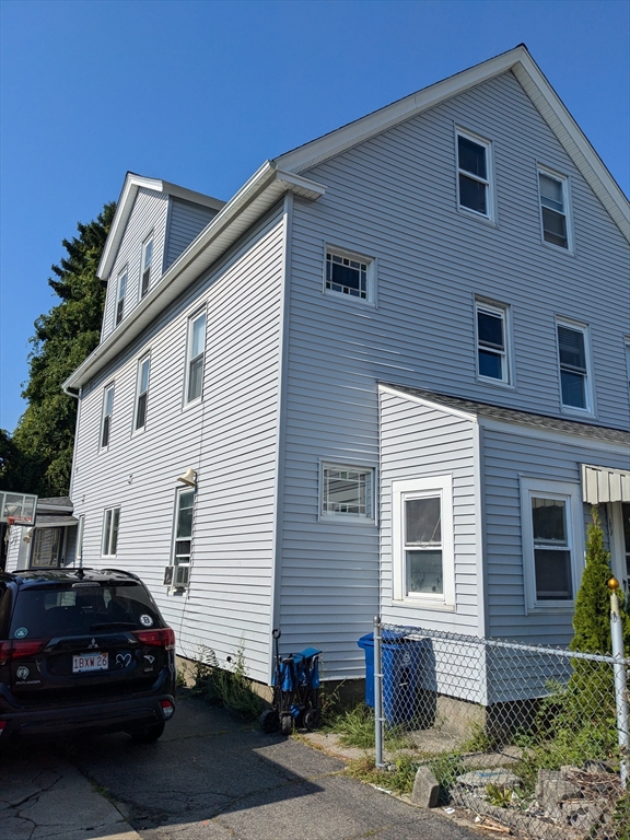 a car parked in front of a house