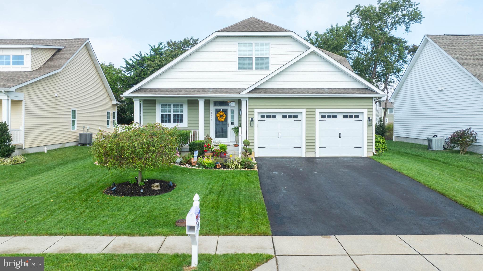 a view of a yard in front view of a house