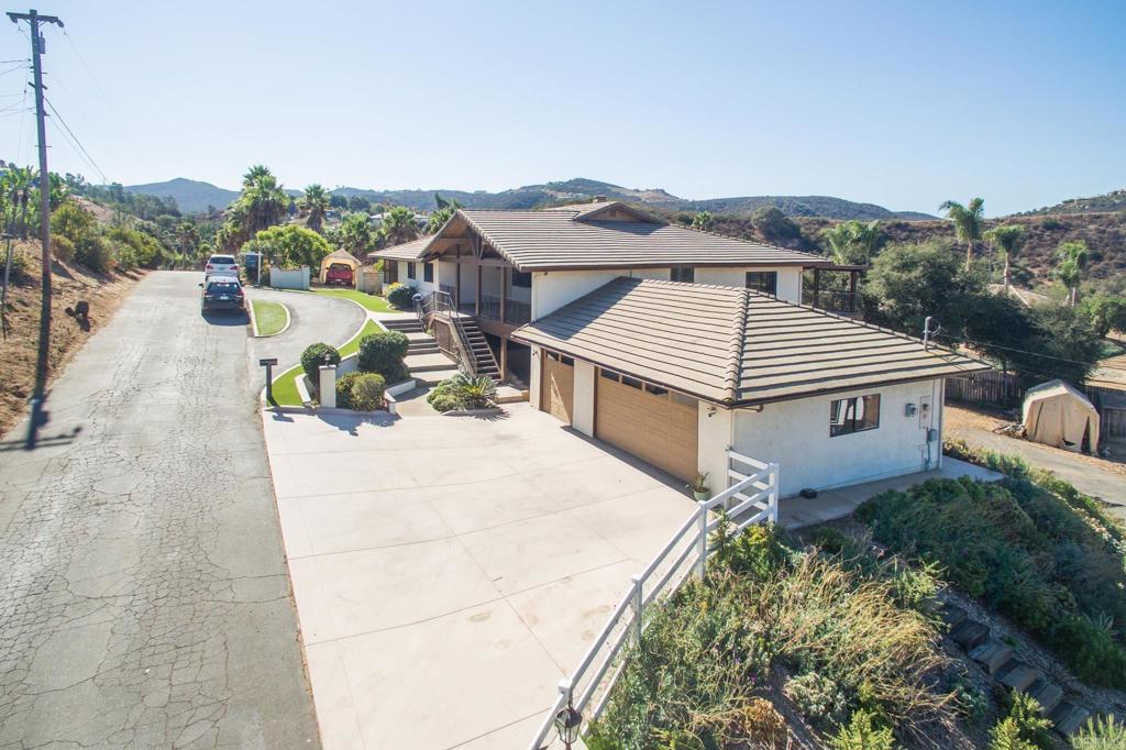 a view of a house with a backyard and a kitchen