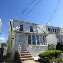 front view of a house with a small yard