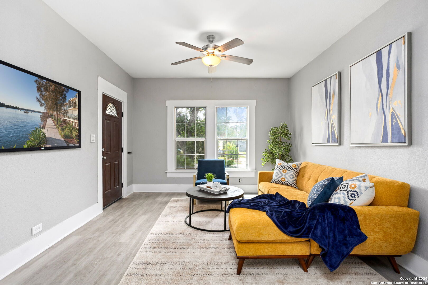 a living room with furniture and a large window