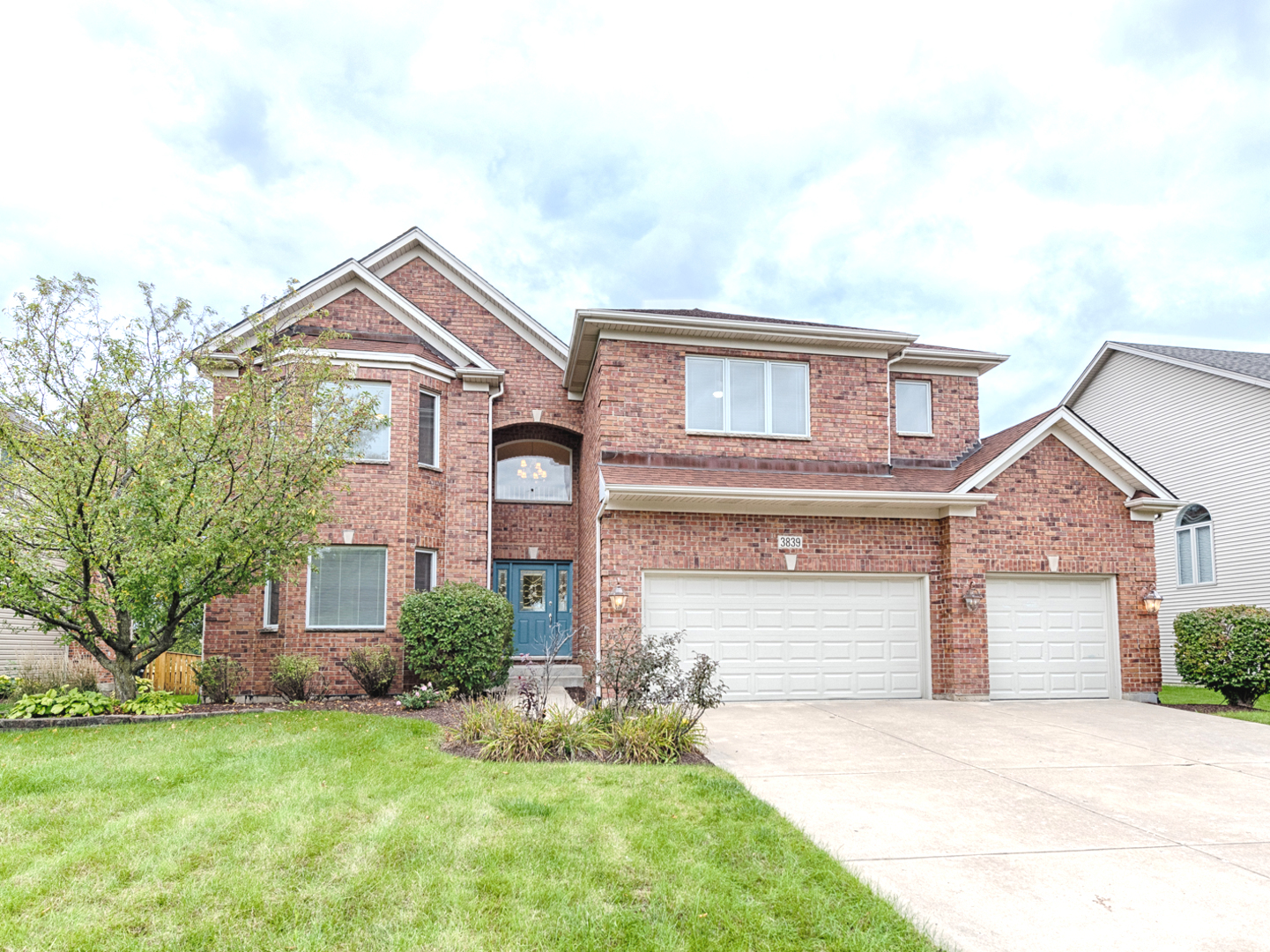 front view of a house with a yard