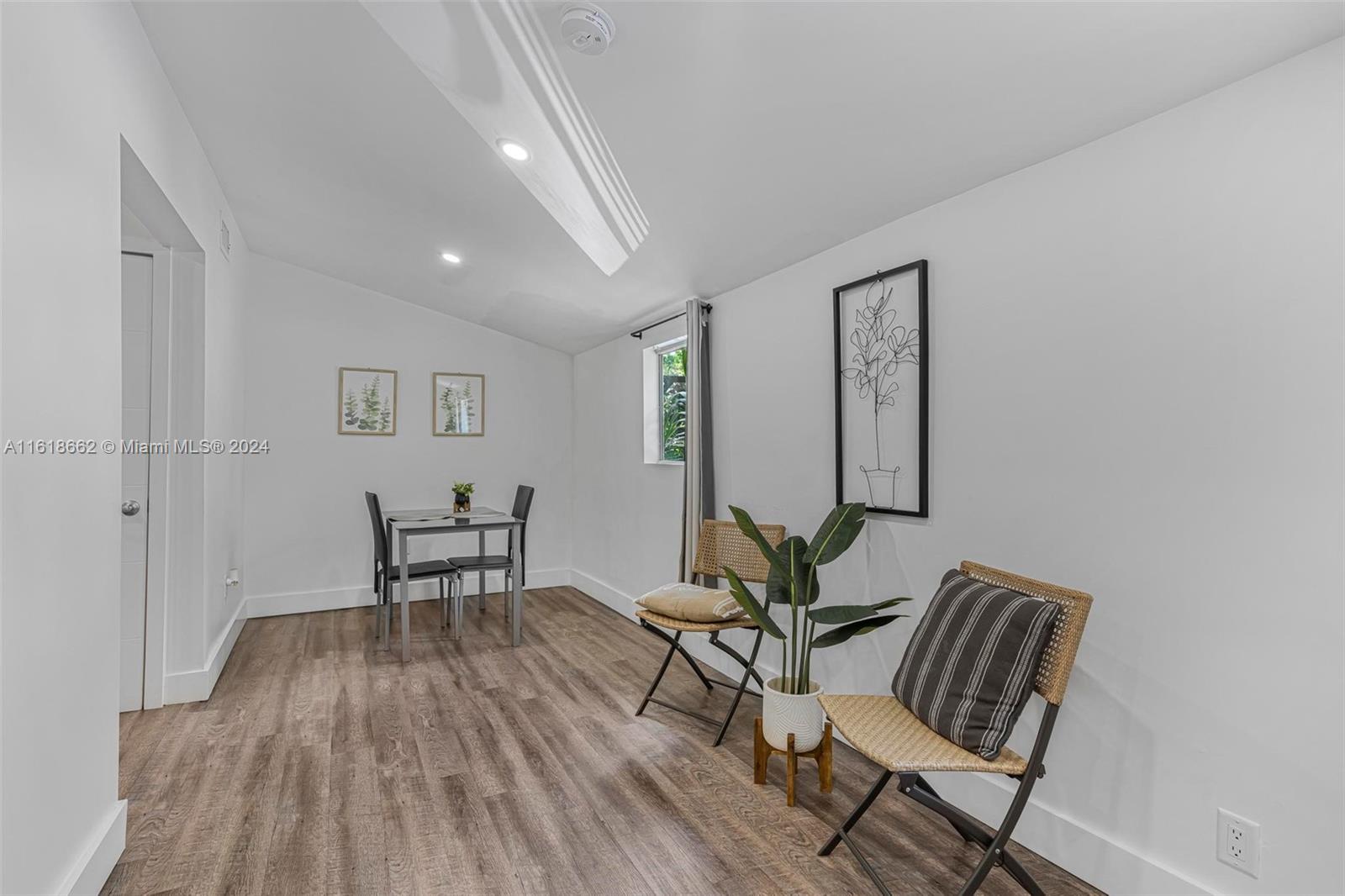 a view of a livingroom with furniture and wooden floor