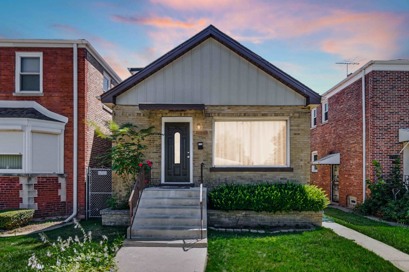 front view of a house with a yard