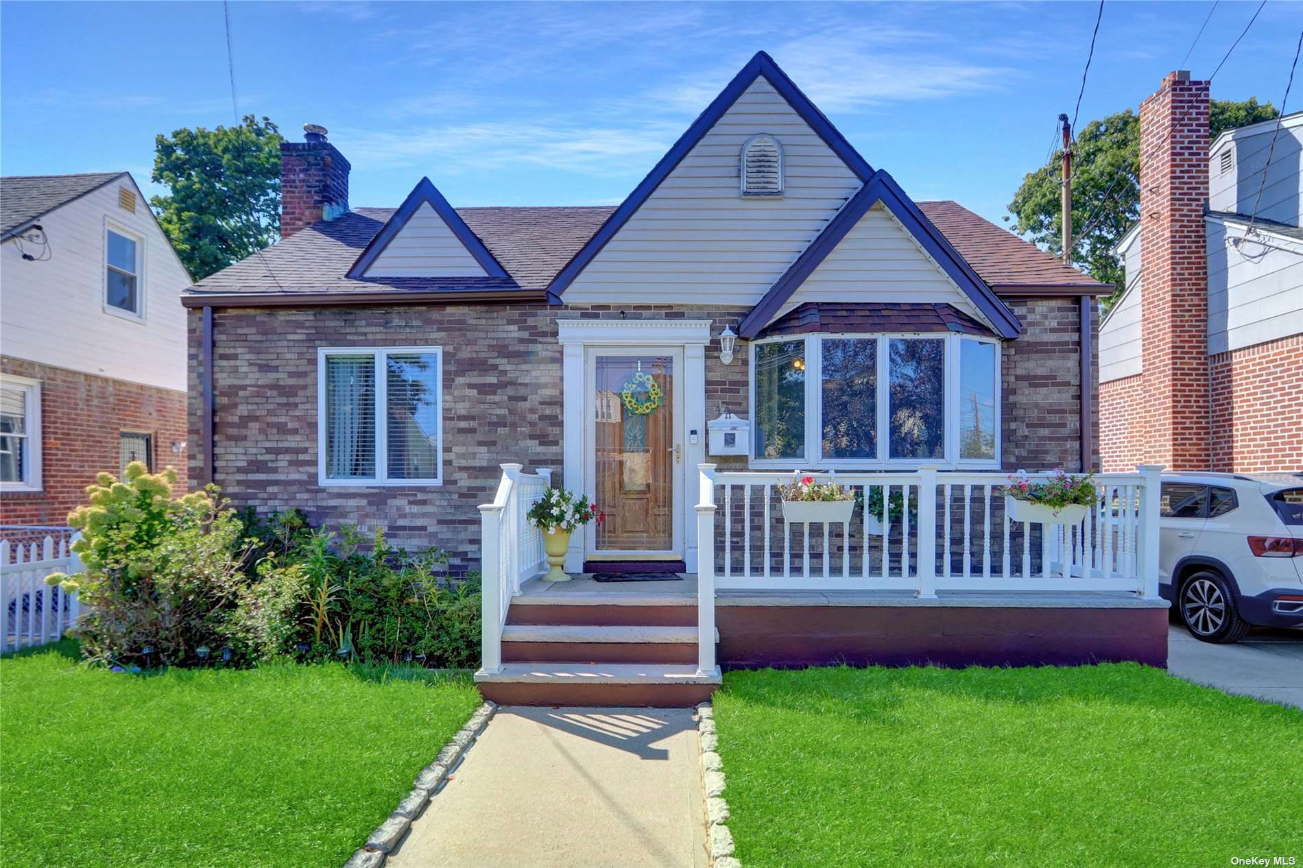 a front view of a house with garden