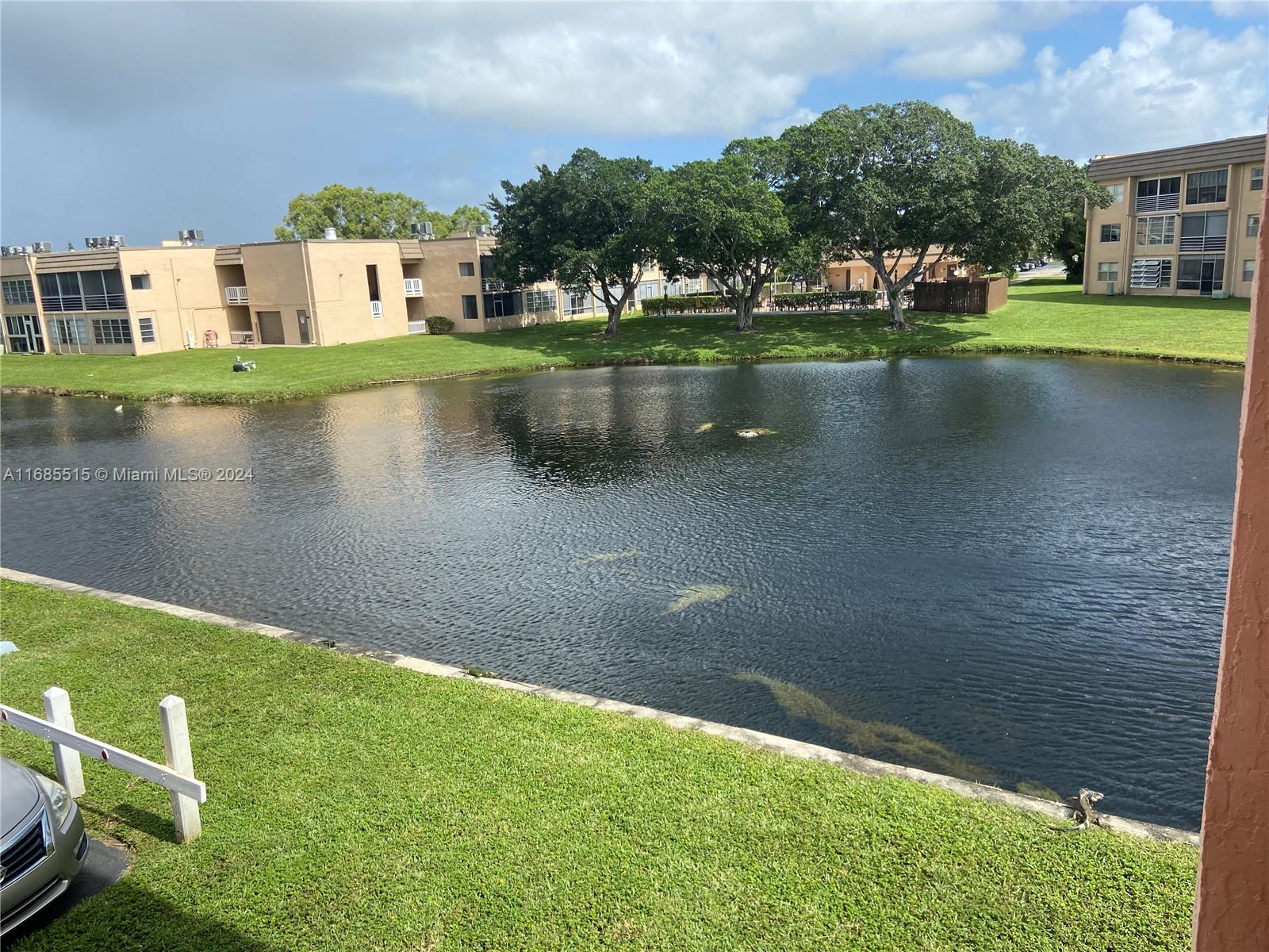 a view of a lake with a house in the background