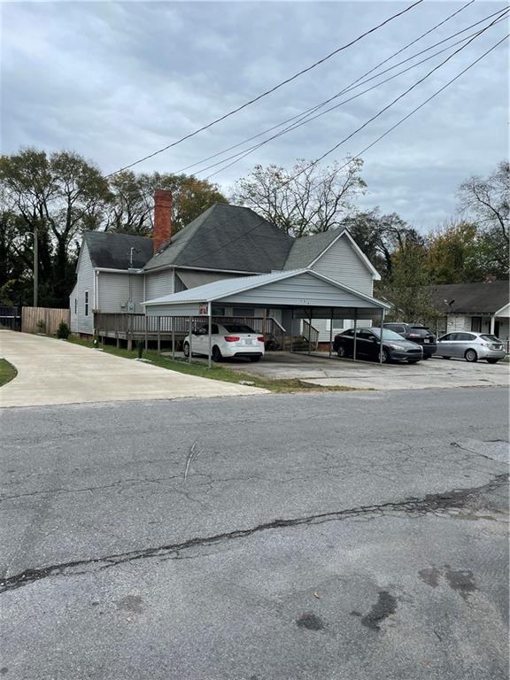 a view of houses with cars parked