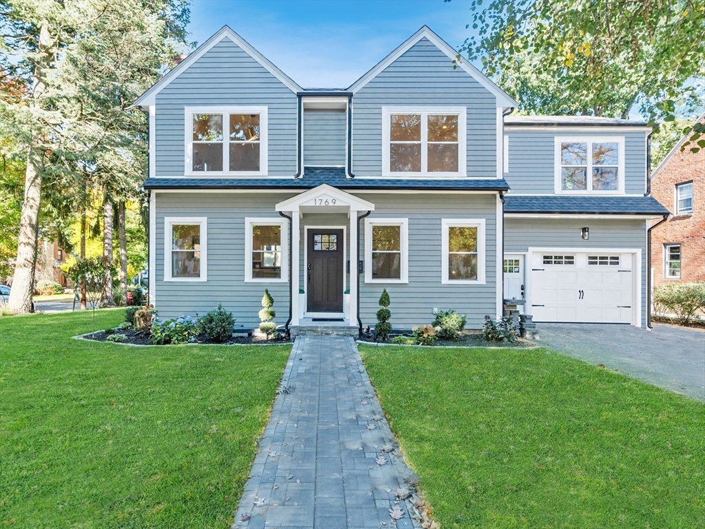 a front view of a house with a yard