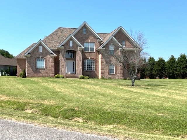 a front view of a house with a yard