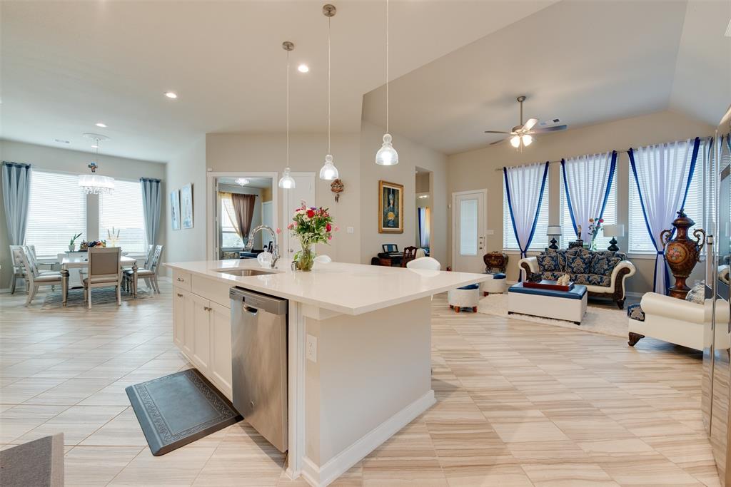 a view of a living room kitchen and a wooden floor