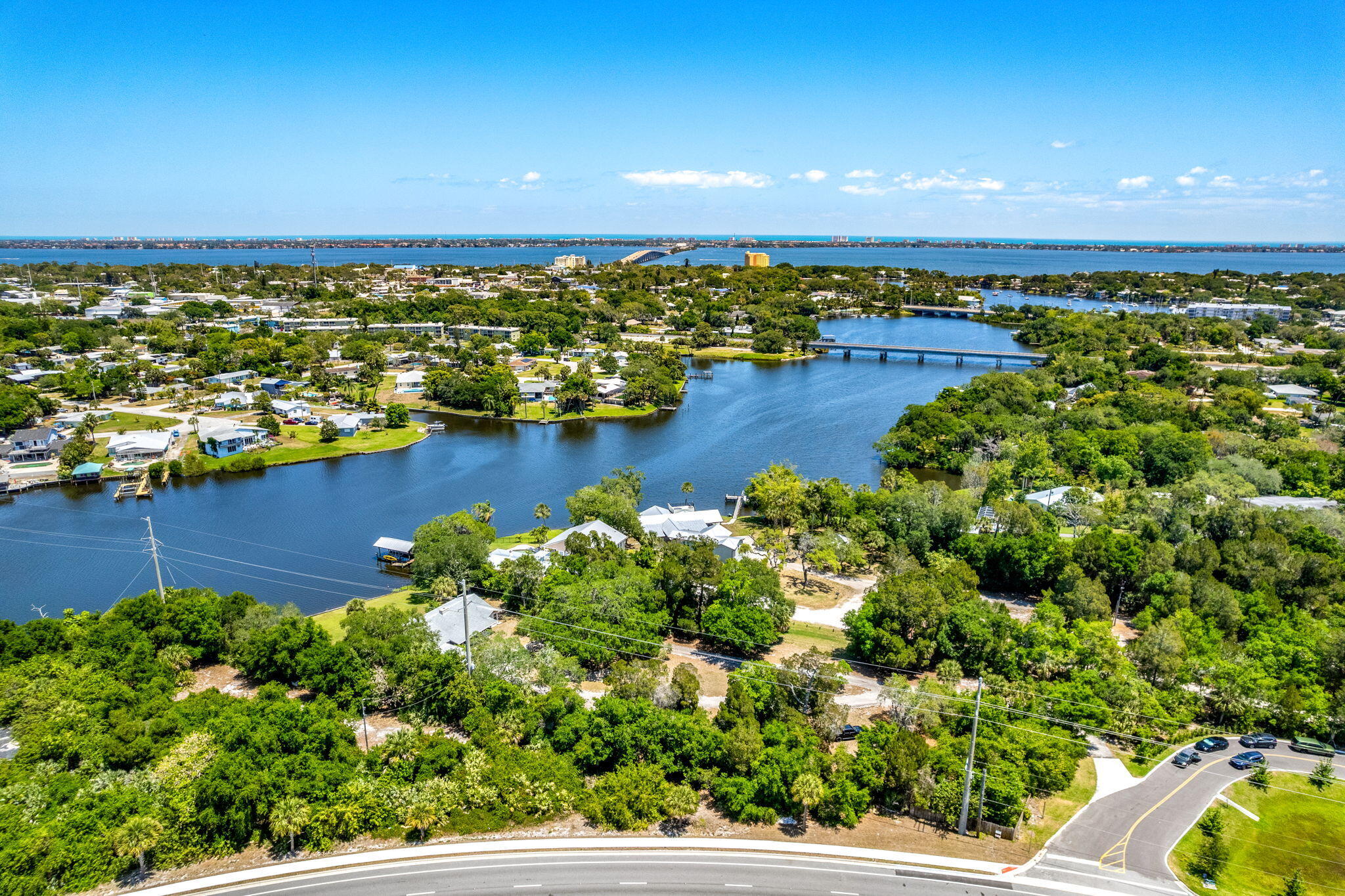 an aerial view of a houses with a lake view