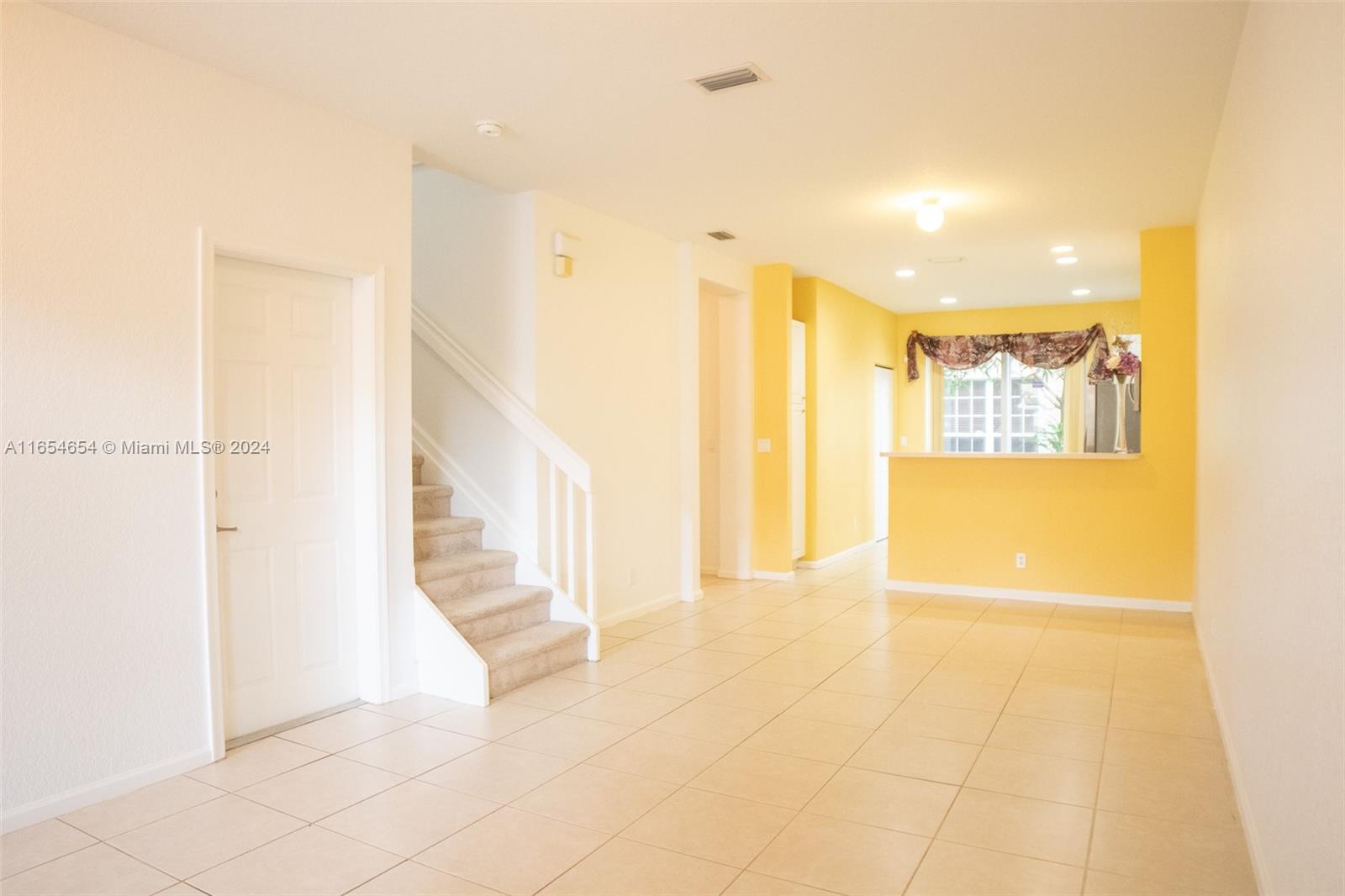 a view of hallway with windows