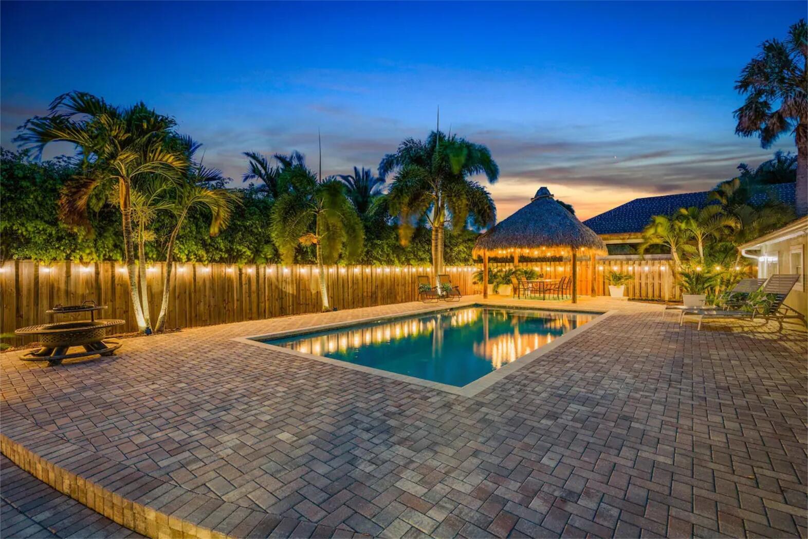 a view of swimming pool with outdoor seating