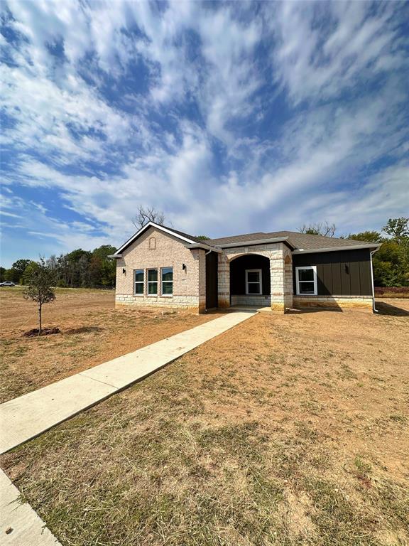 a house with yard in front of it