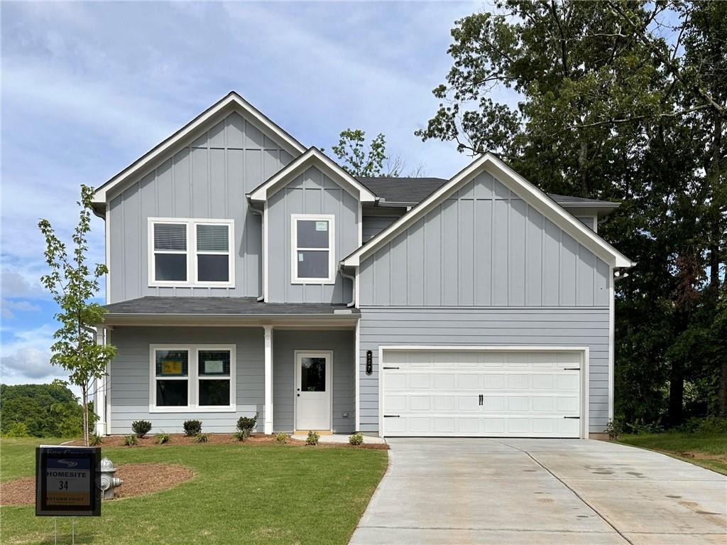 a view of house with yard