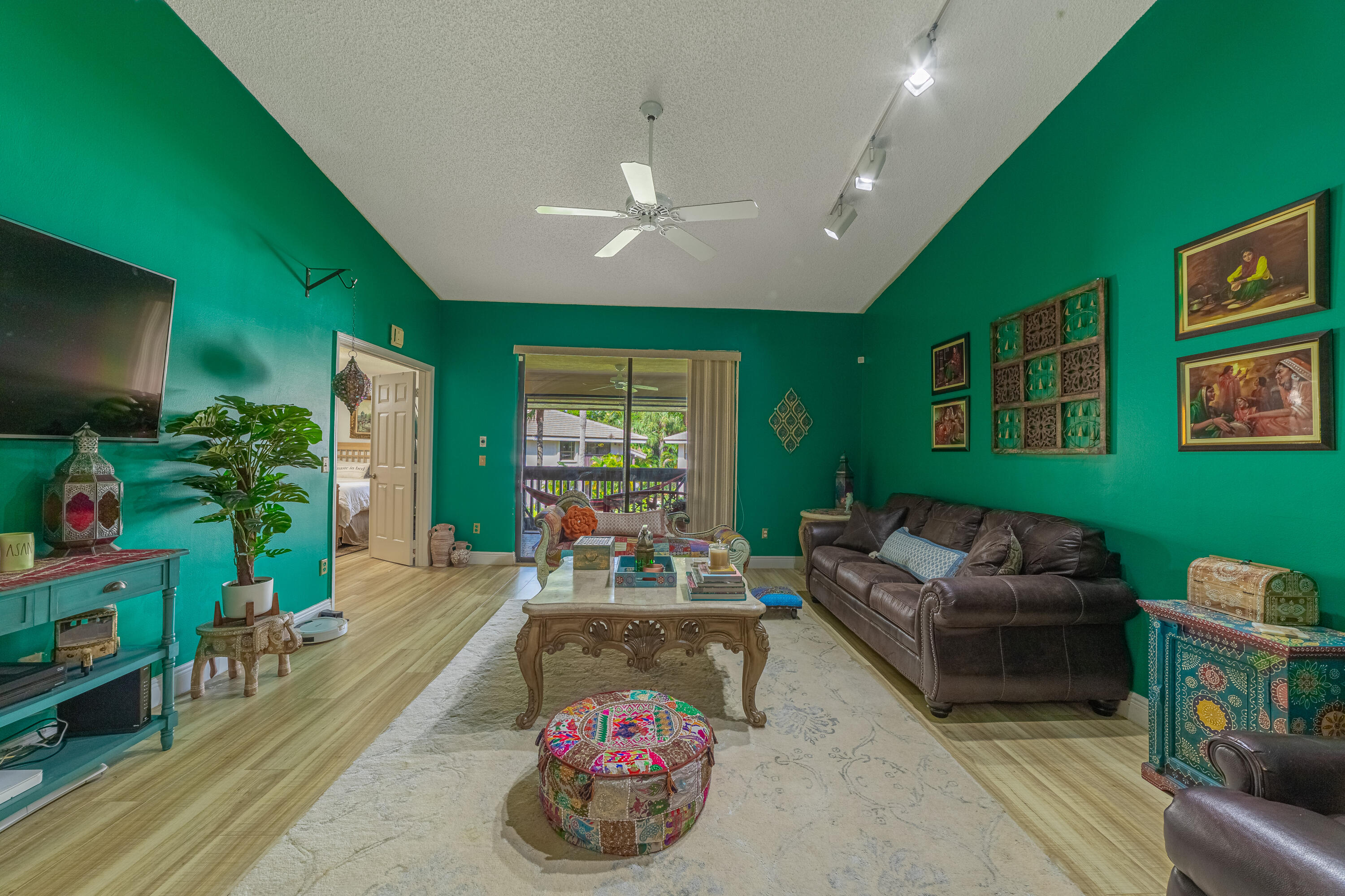 a living room with furniture and a flat screen tv