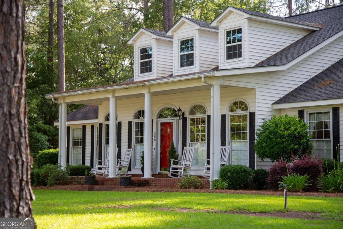 a front view of a house with garden