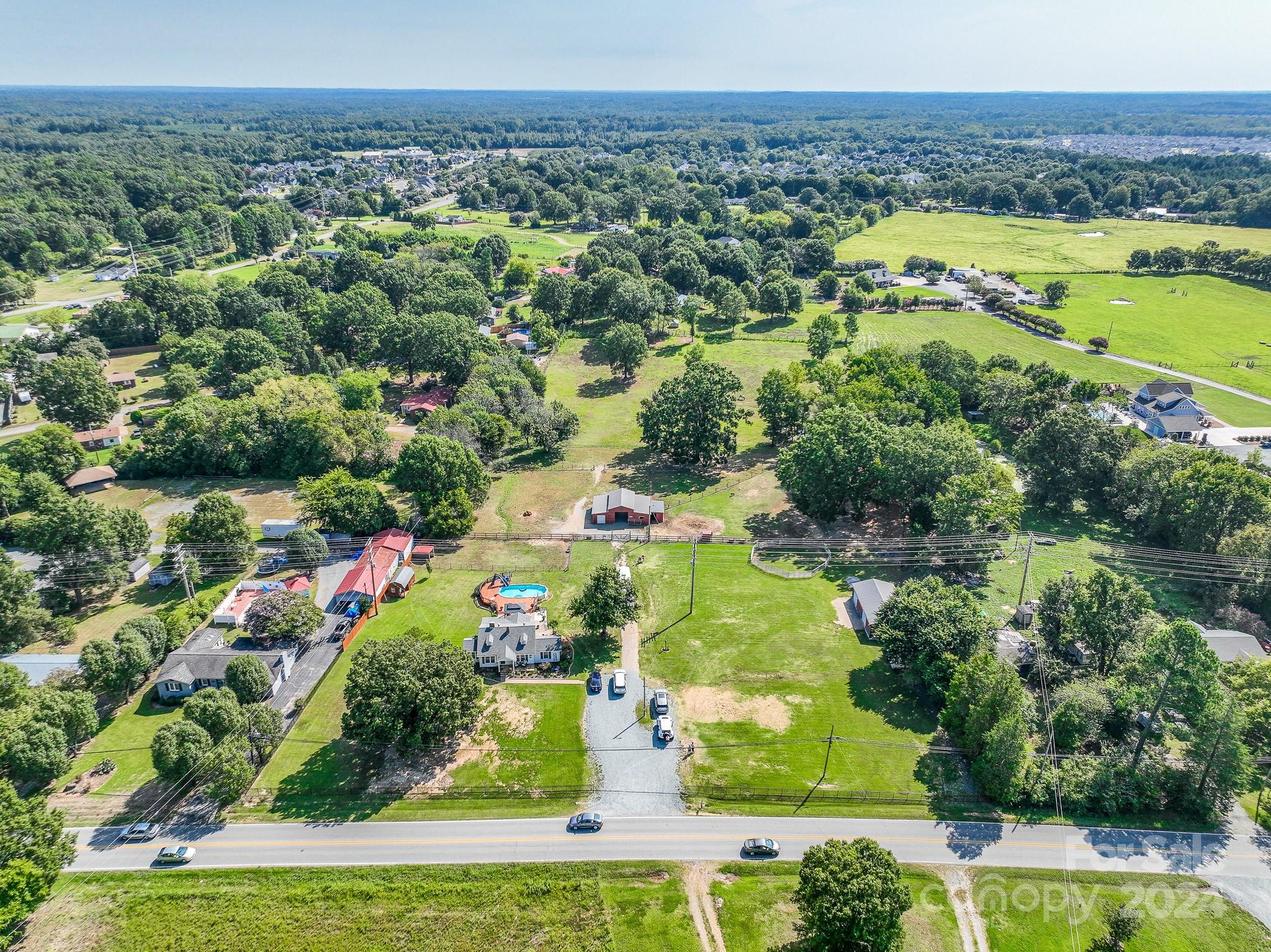 an aerial view of a houses with a lake view