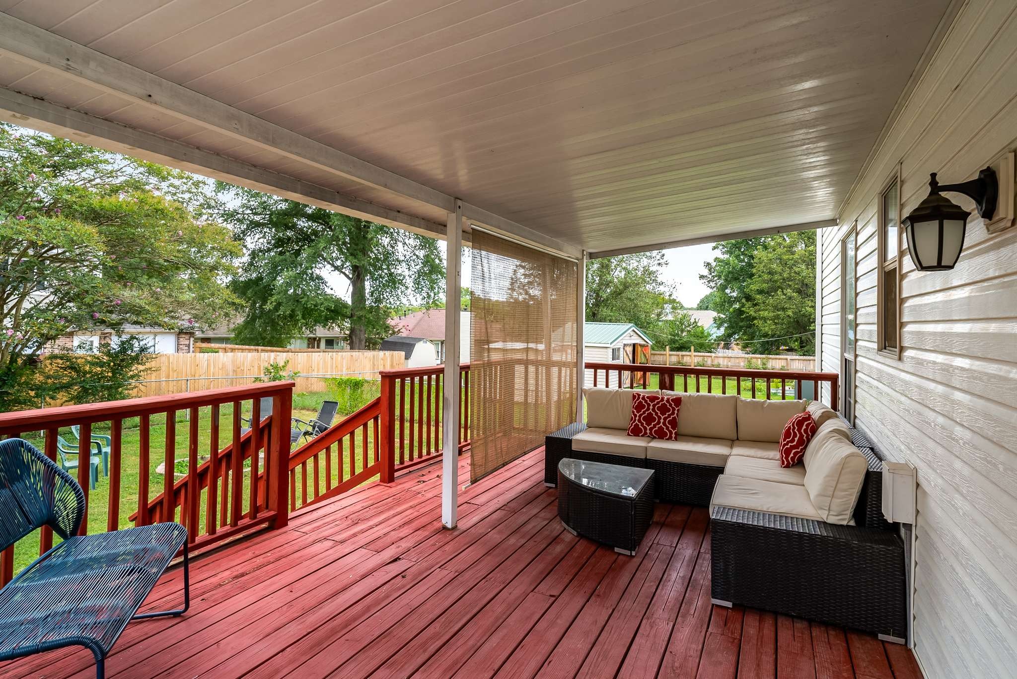 a view of a balcony with wooden floor