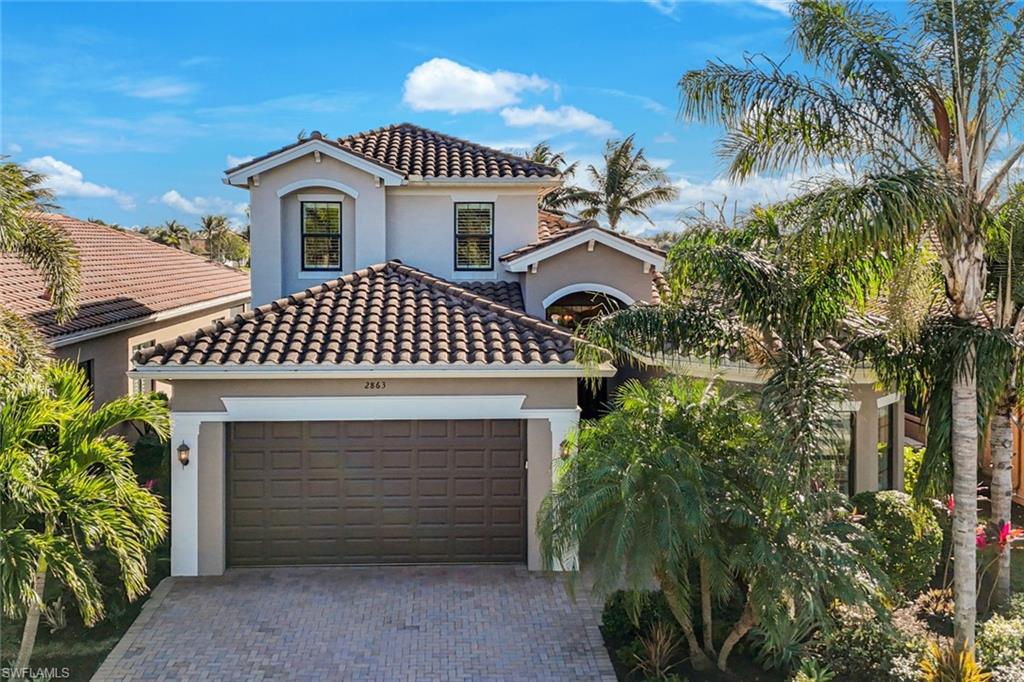 a front view of a house with a garage