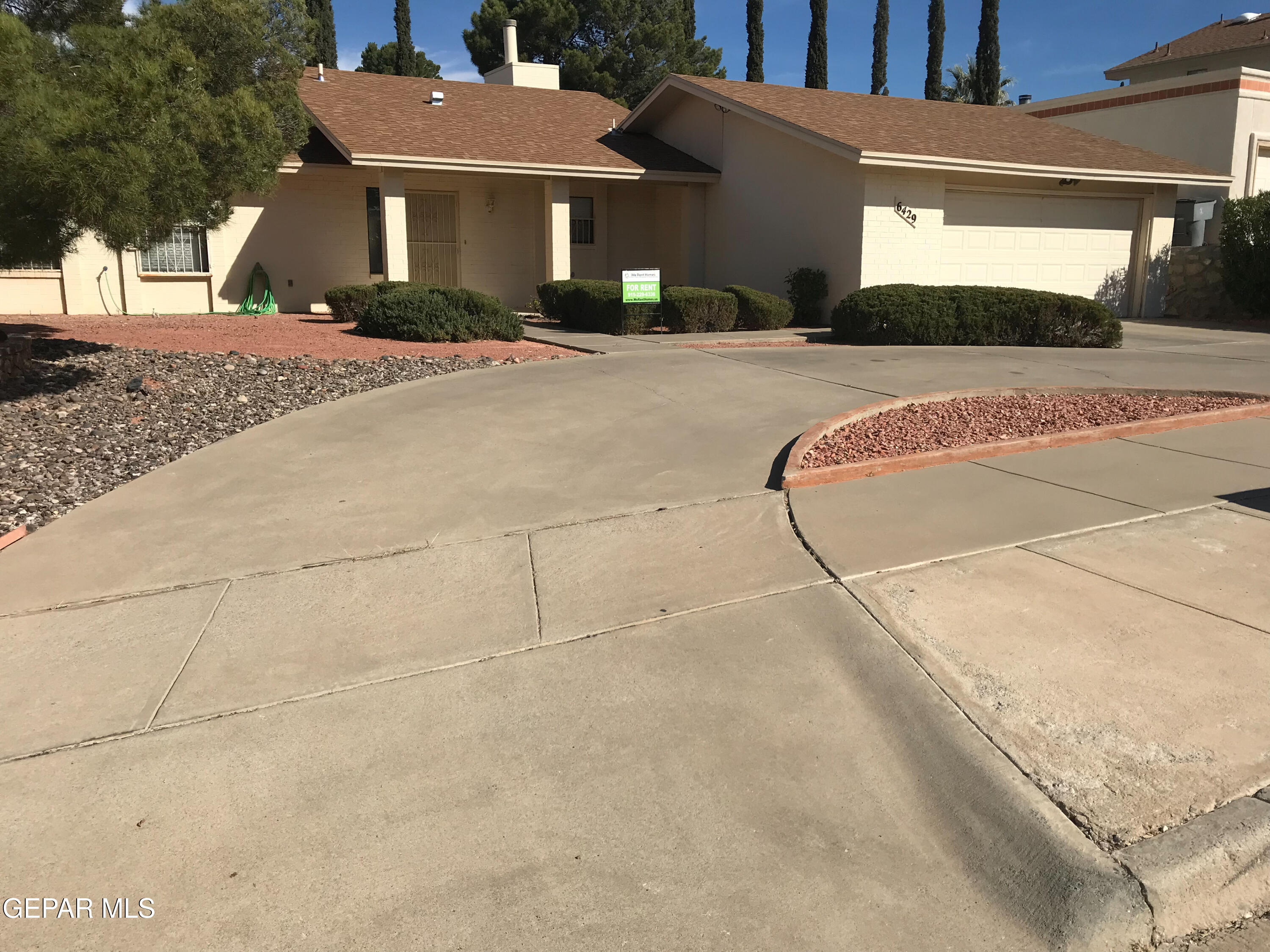 a view of a house with a street