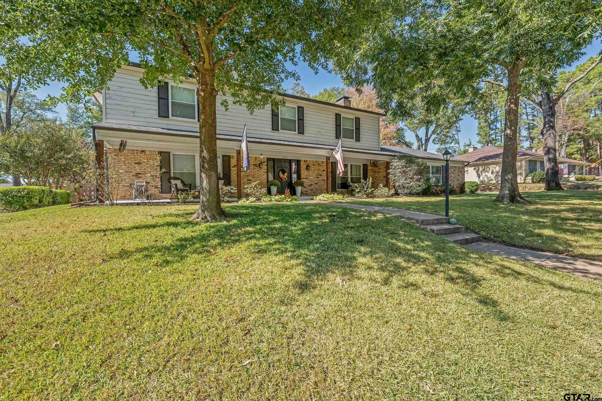 front view of a house with a yard