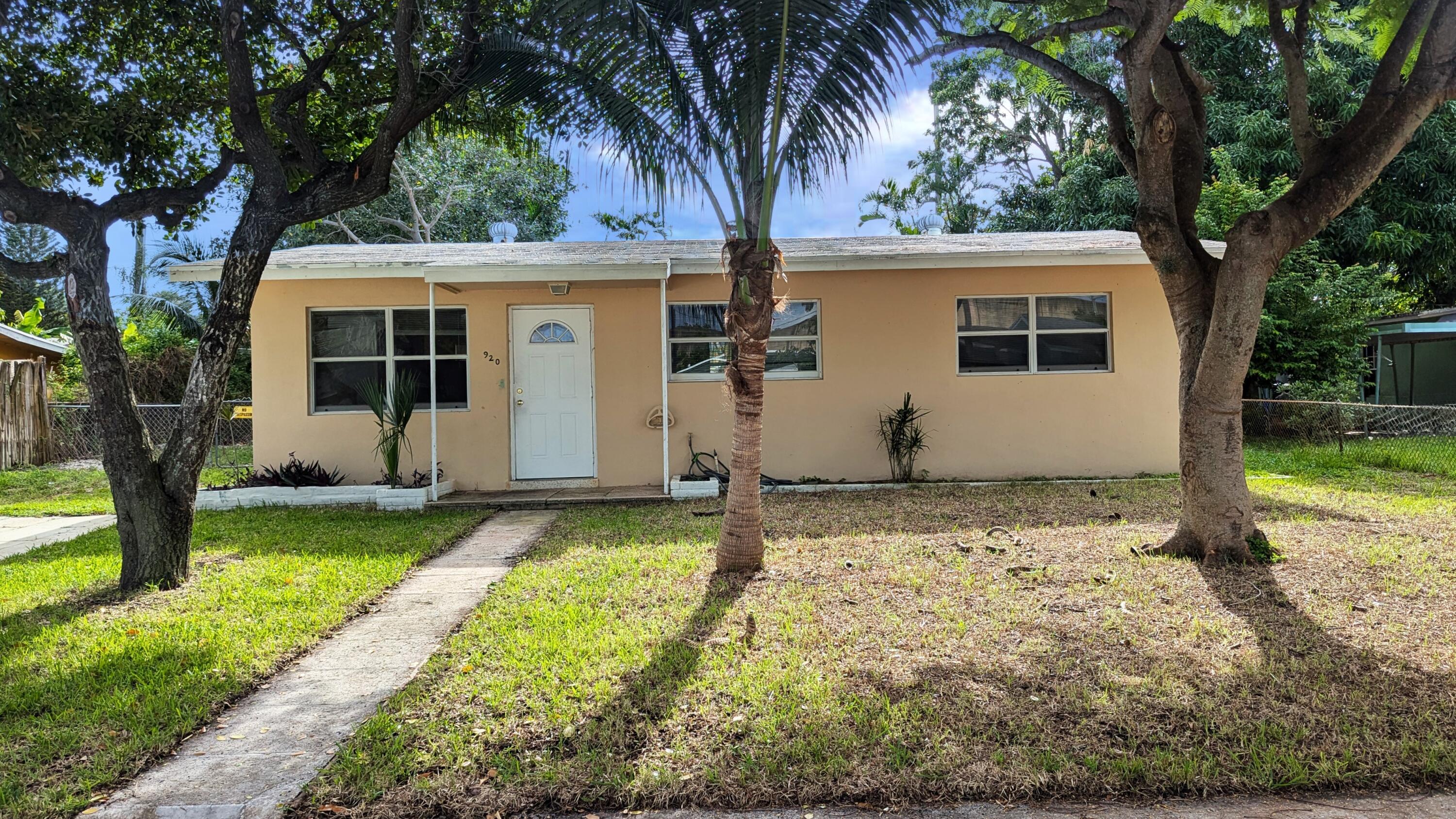 front view of a house with a yard