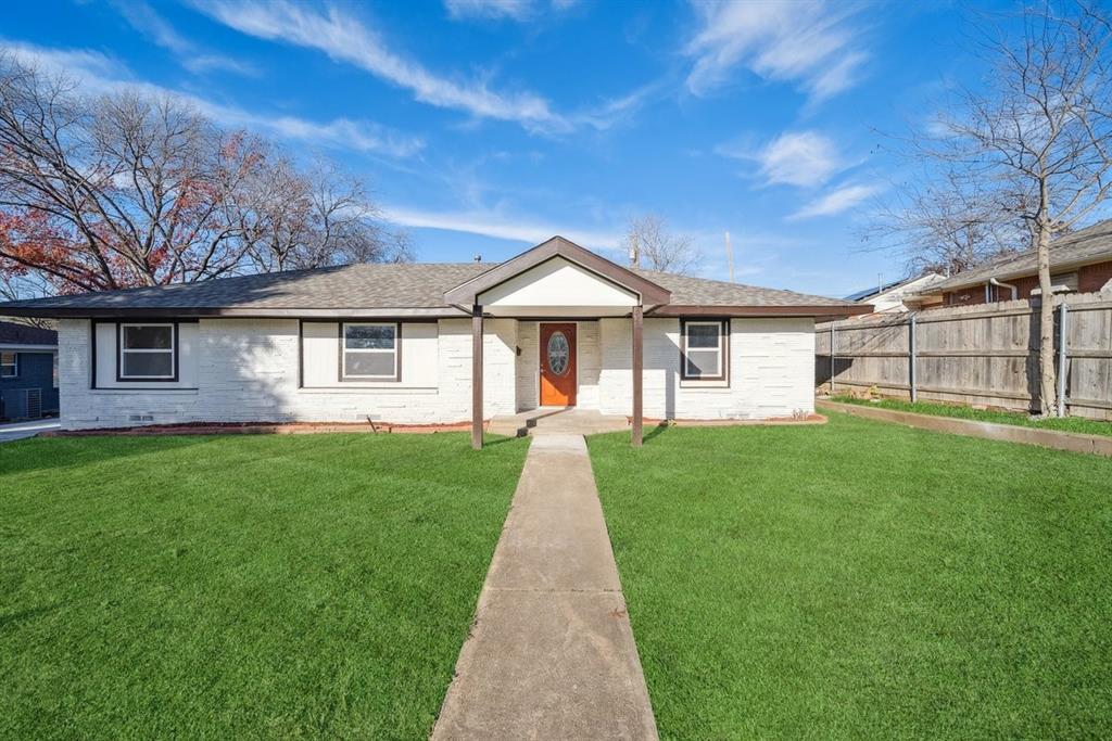 a front view of a house with yard