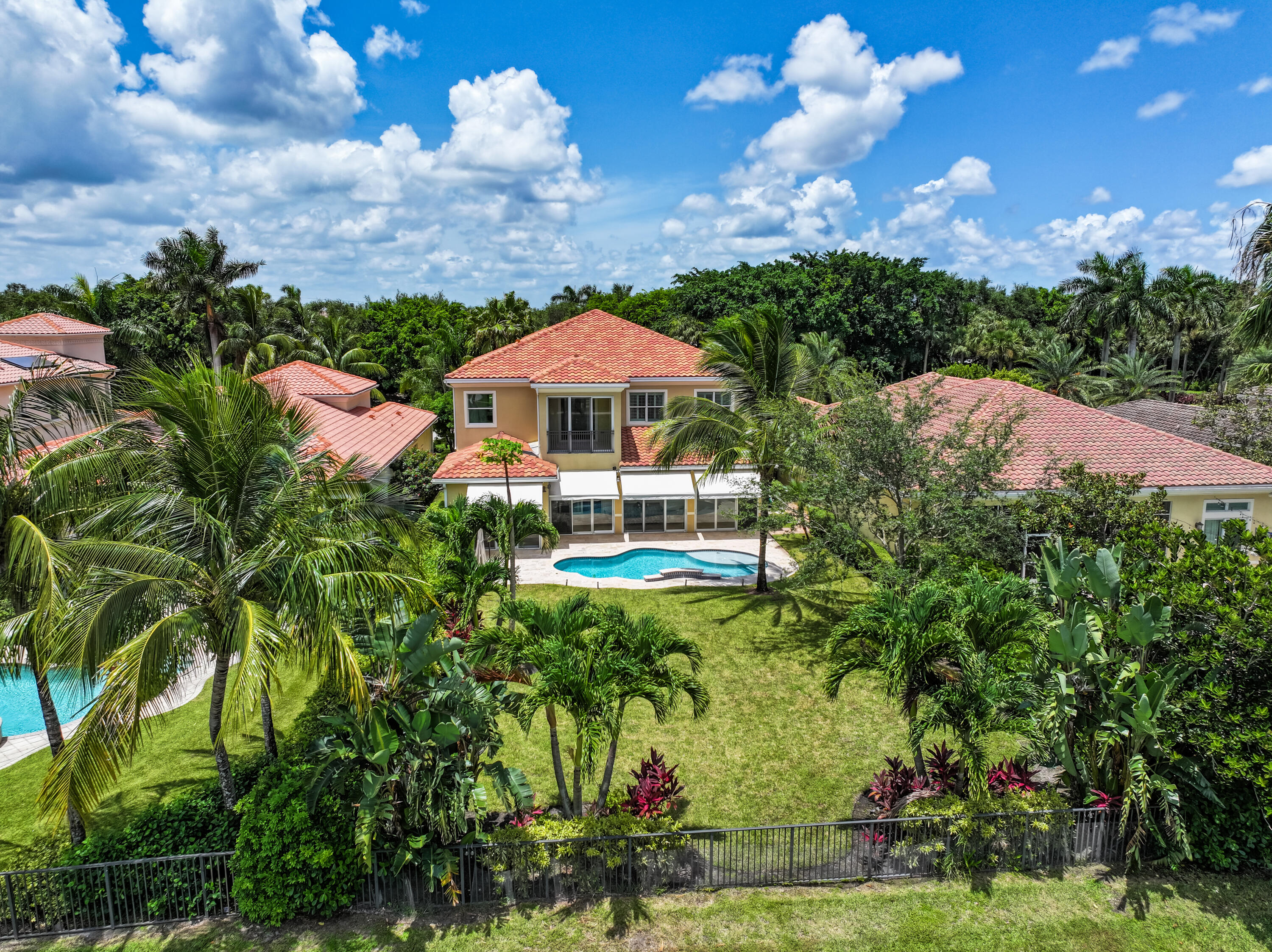 a aerial view of a house with yard swimming pool and outdoor seating