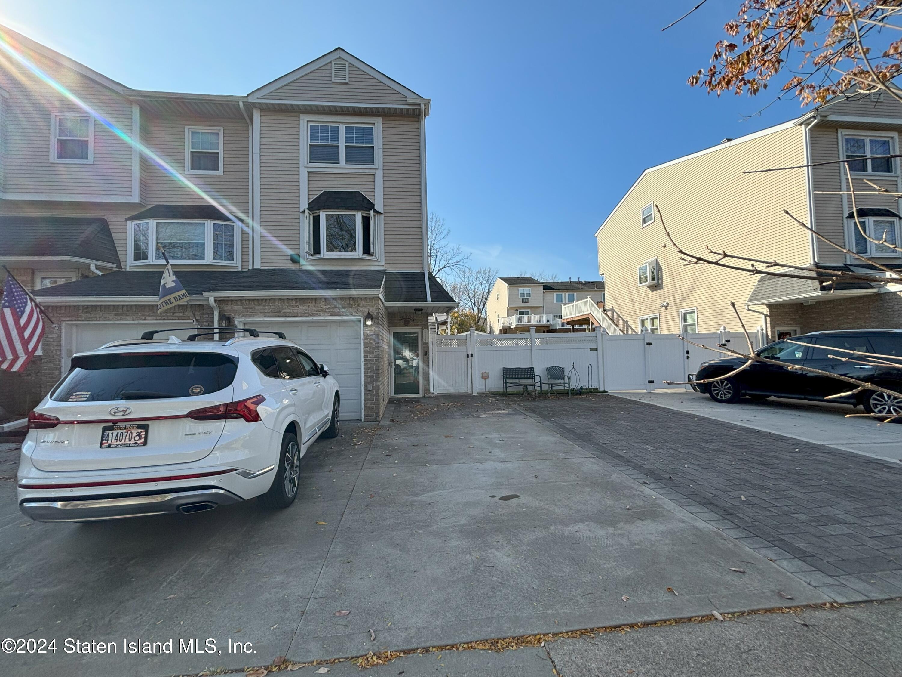 a view of a car park in front of house