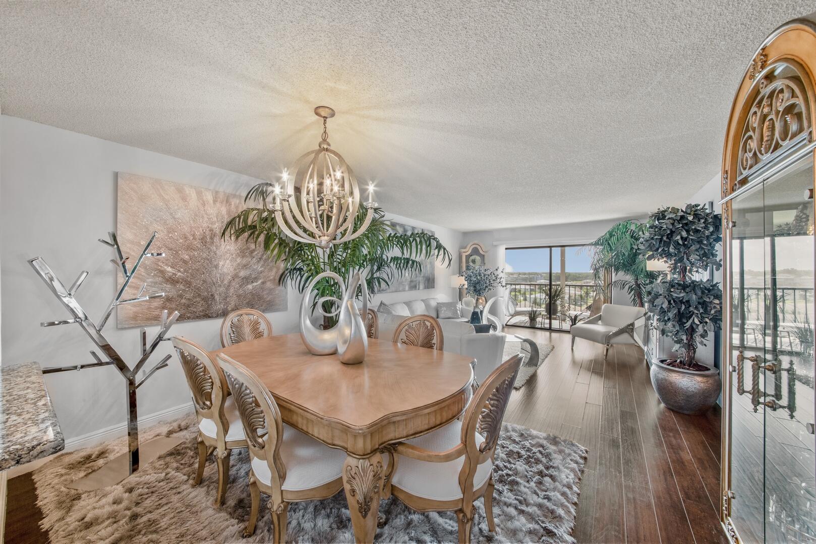 a view of a dining room with furniture and wooden floor