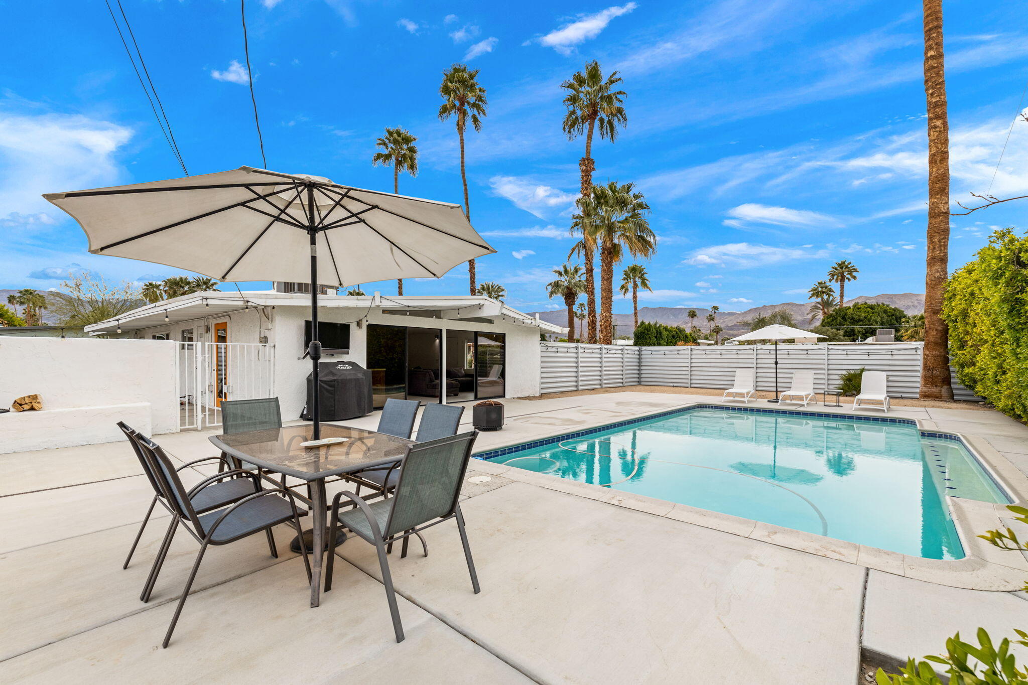 a view of a swimming pool with a patio