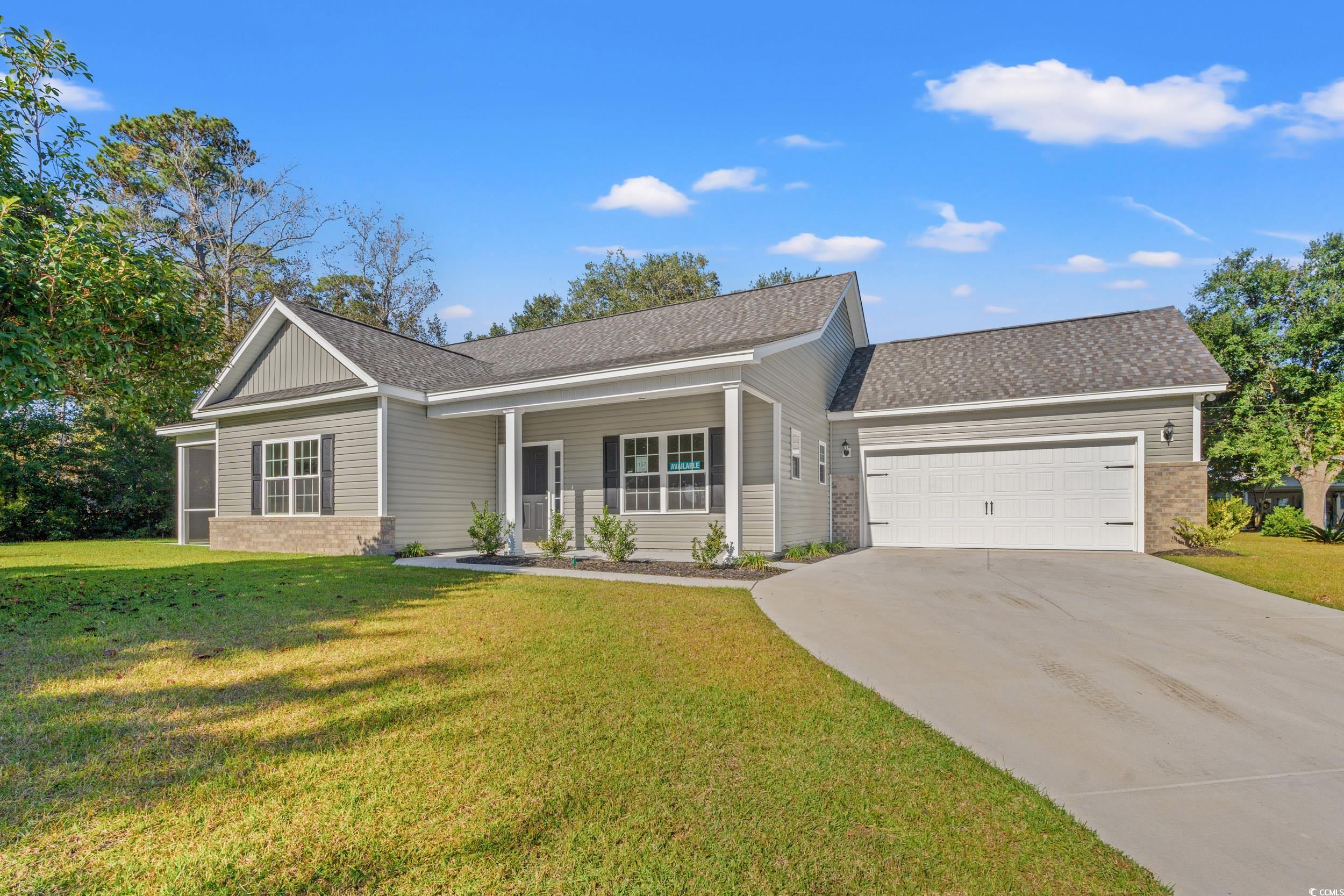 Ranch-style home with covered porch, a garage, and