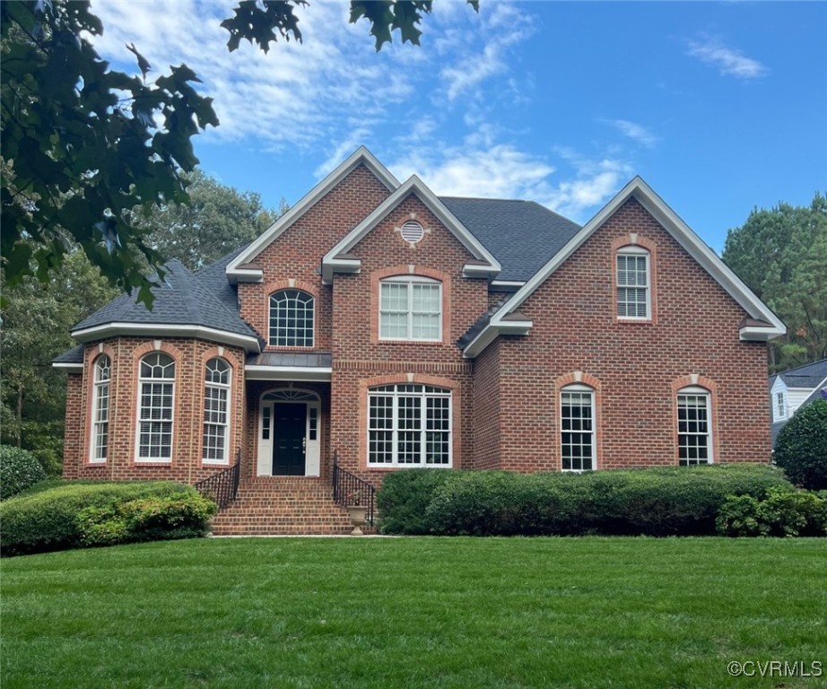 a front view of a house with a yard