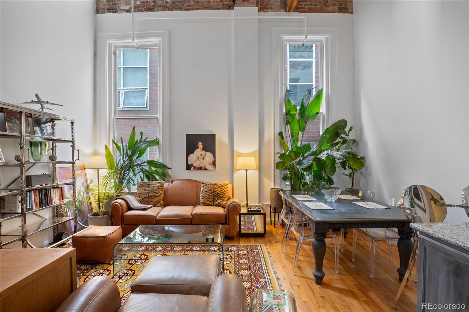 a living room with furniture plant and a potted plant