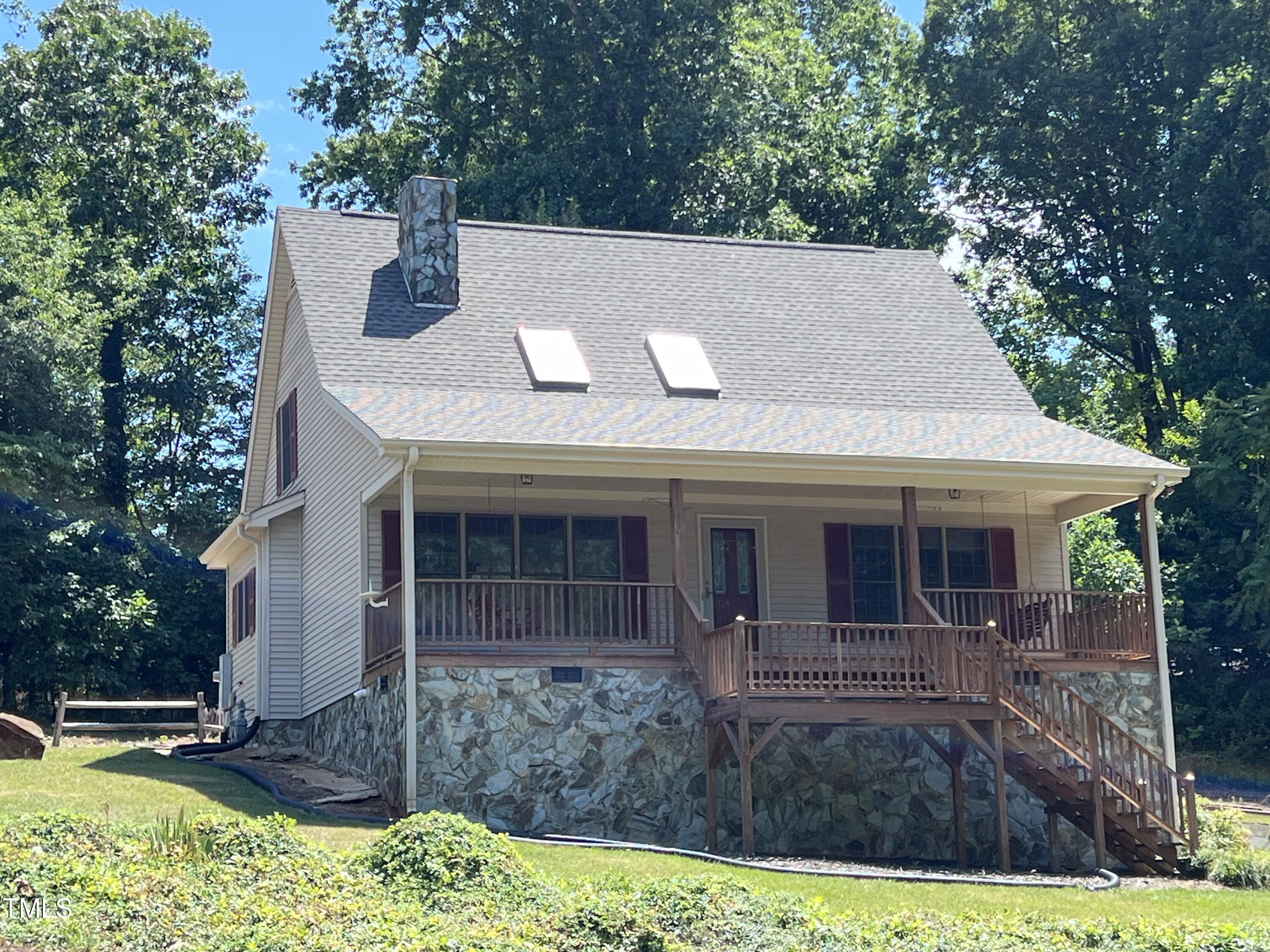 a view of house with yard