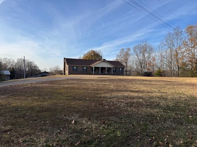 View of front of property featuring a front yard