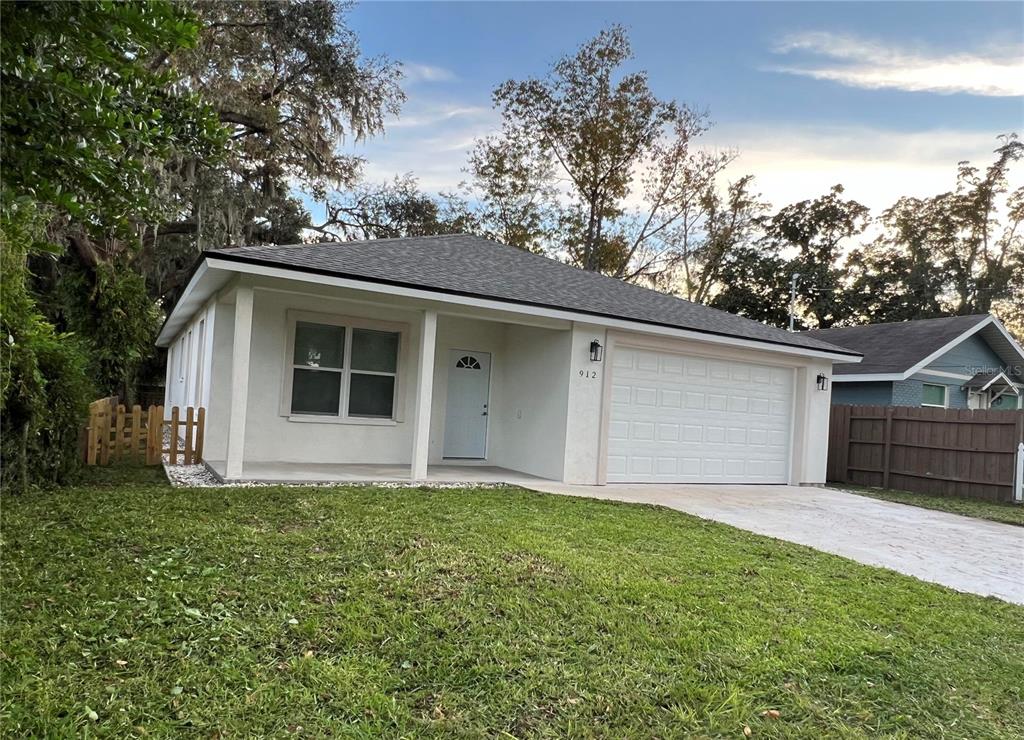 a house with trees in the background