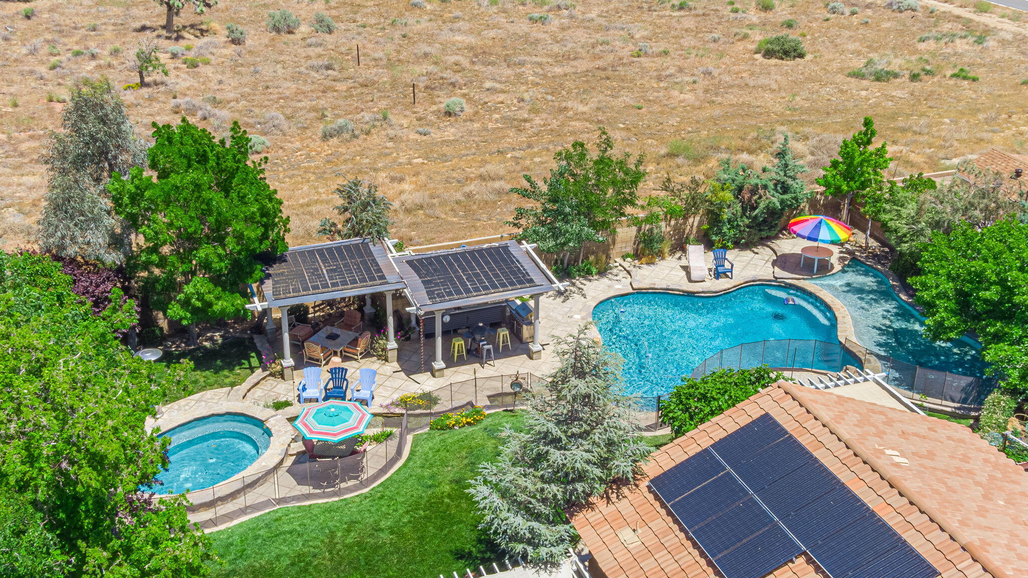 an aerial view of a house with outdoor space