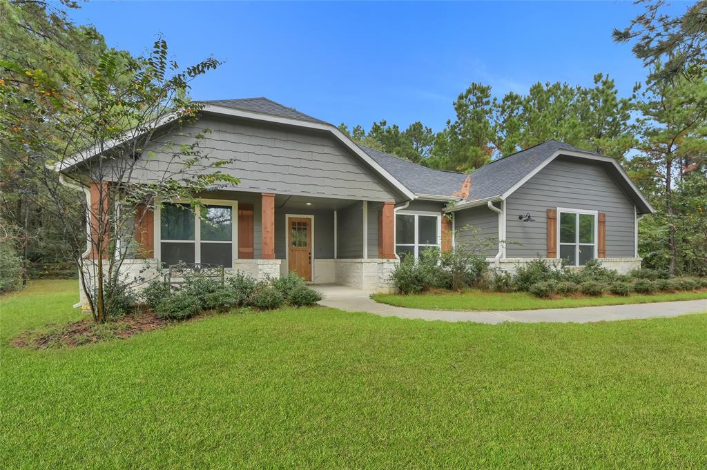 front view of a house and a yard