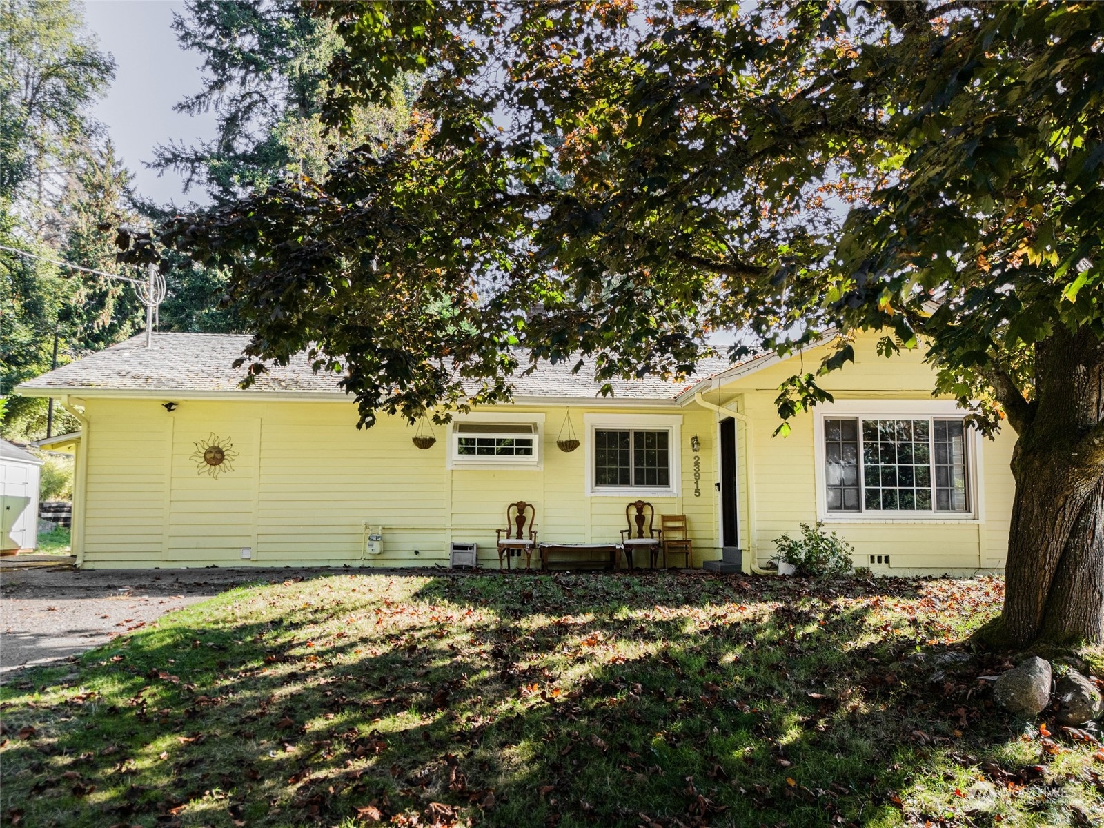 a front view of a house with a yard